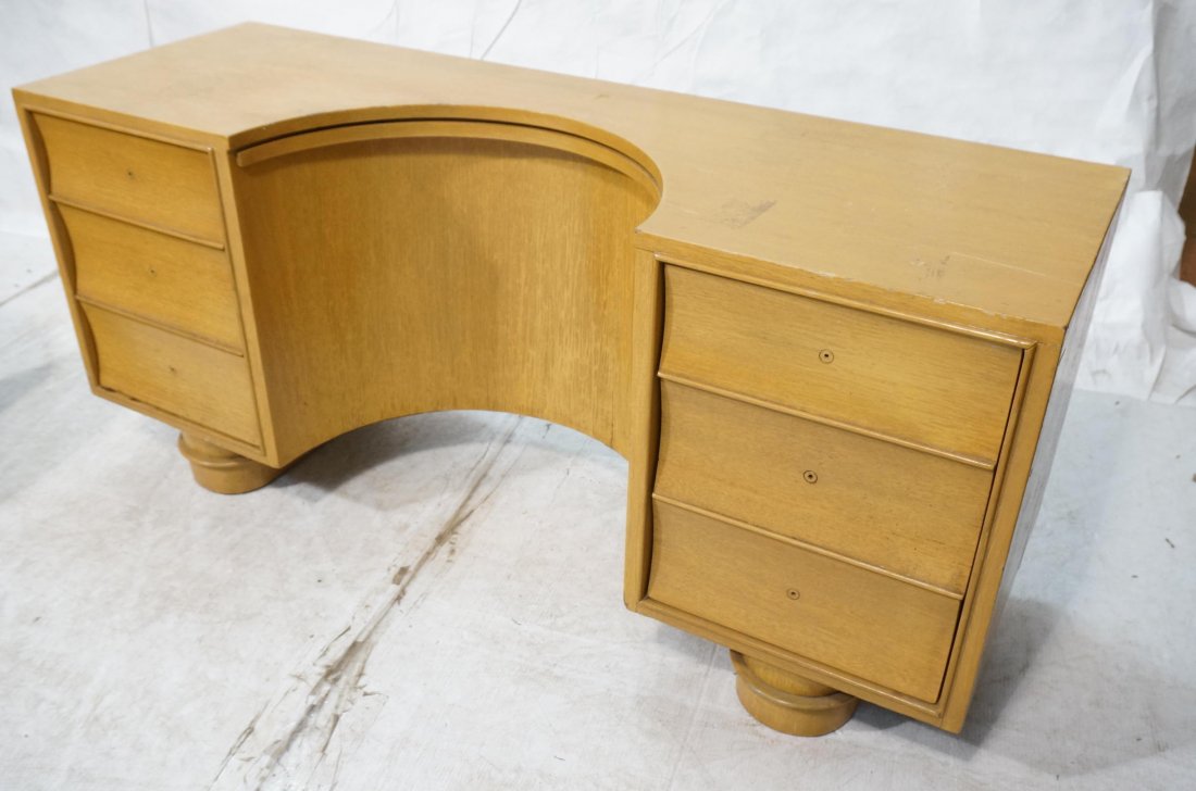 Blond Wood Mid Century Vanity. Frankl style. Miss: Blond Wood Mid Century Vanity. Frankl style. Missing Mirror. No handles. Six drawers with curved fronts. Two pedestal bases. -- Dimensions: H: 25 inches: W: 55 inches: D: 18 inches ---