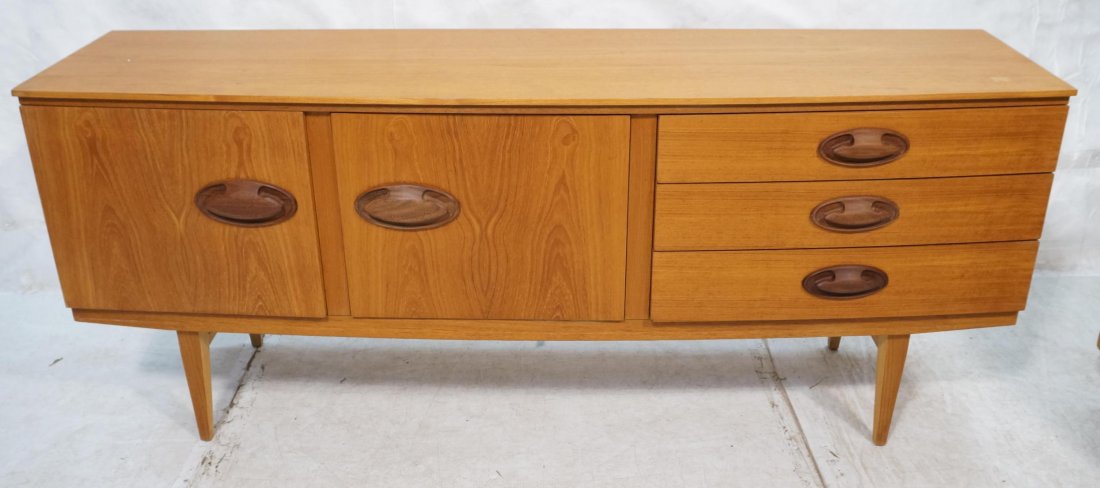 Danish Modern Teak Credenza. Two Doors. Three Dra: Danish Modern Teak Credenza. Two Doors. Three Drawers. Large Oval Contrasting wood pulls. Square peg legs-- Dimensions: H: 30.5 inches: W: 72 inches: D: 19 inches ---