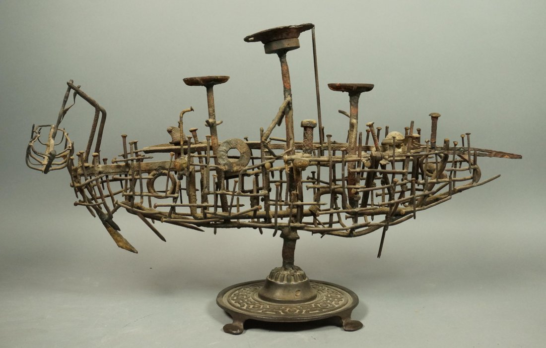 Brutalist Nail Ship Sculpture. Decorated with car: Brutalist Nail Ship Sculpture. Decorated with cartridges, washers and springs. On heavy metal footed base.-- Dimensions: H: 18 inches: W: 31 inches: D: 11 inches ---