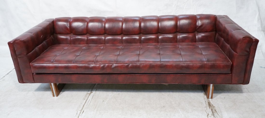 Modernist Chesterfield style Couch. Wine Colored: Modernist Chesterfield style Couch. Wine Colored Vinyl Sofa. Wood & Chrome Base. -- Dimensions: H: 26 inches: W: 90 inches: D: 34.25 inches ---