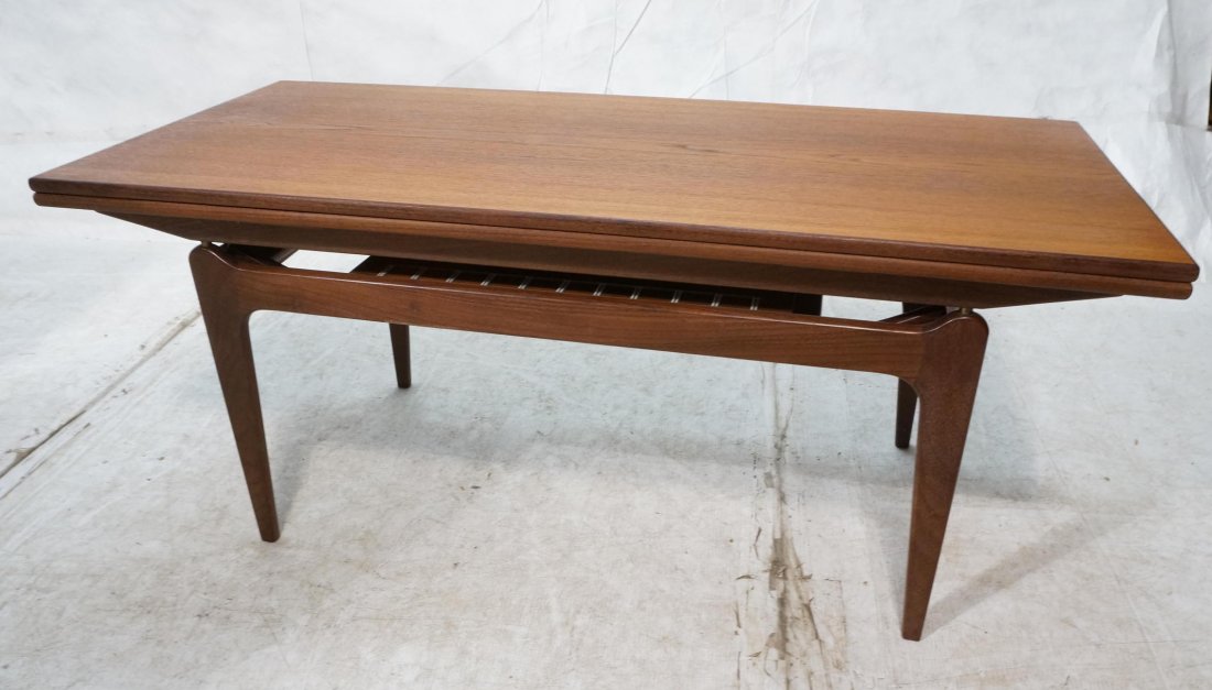 Danish Teak Convertible Extension Coffee Table. T: Danish Teak Convertible Extension Coffee Table. Top lifts up and sides pull out. Extension Cocktail Table. Each retractible leaf is 8"-- Dimensions: H: 21 inches: W: 48 inches: D: 21 inches ---