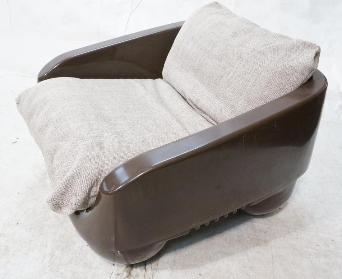 Italian Brown Molded Plastic Lounge Chair. Sits o: Italian Brown Molded Plastic Lounge Chair. Sits on four large ball feet. One upholstered sling cushion. Marked AMPAFORM Italy. -- Dimensions: H: 24 inches: W: 33 inches: D: 31 inches ---
