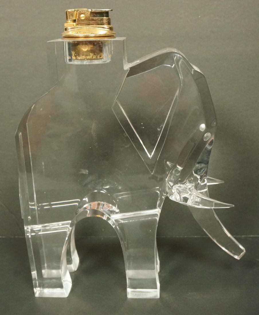 Large Italian TIMOS Lucite Elephant Lighter. 70's: Large Italian TIMOS Lucite Elephant Lighter. 70's Modern Mid Century. Signed-- Dimensions: H: 9.75 inches: W: 8.5 inches: D: 2.25 inches --- US Shipping charge: $35