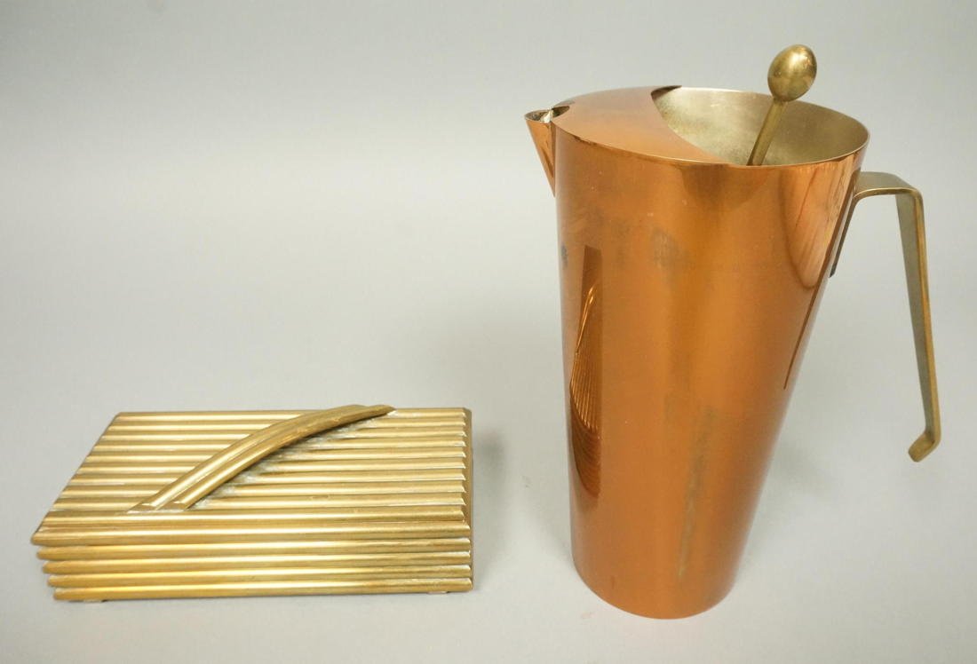 2pc Metal Vintage Modern Lot. 1). Brass box with: 2pc Metal Vintage Modern Lot. 1). Brass box with ribbed design. 2). Italian Copper Pitcher with brass handles and stirrer. Box is very heavy construction with wood lining.-- Dimensions: H: 8.25 inches