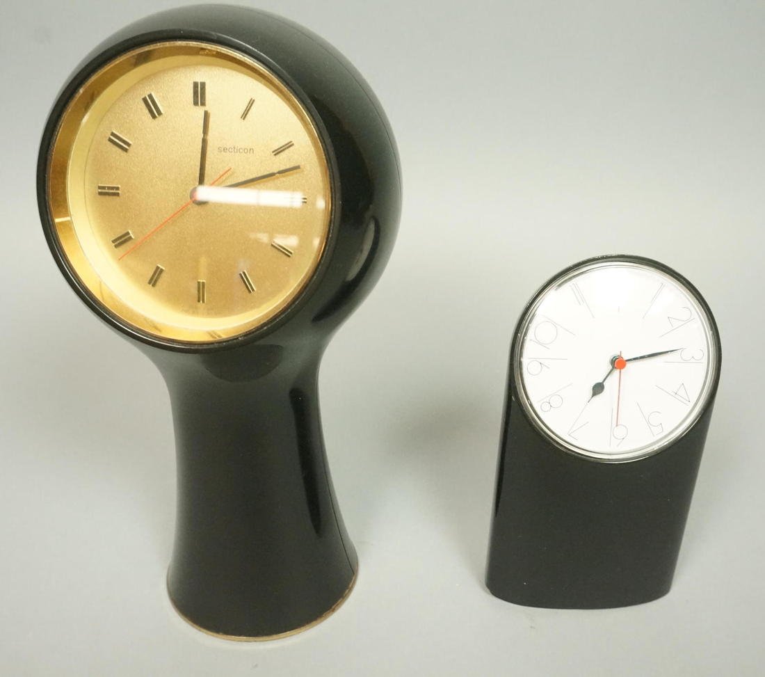 2pc Modernist Design Table Clocks. 1. ARTEMIDE Mo: 2pc Modernist Design Table Clocks. 1. ARTEMIDE Modele Tantalo, design Richard Sapper. Italian black metal case. 2. SECTION Swiss Black Plastic Case. -- Dimensions: H: 9.5 inches: W: 5.5 inches --- US