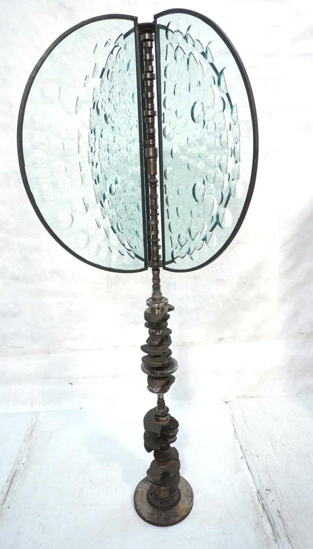 Large Industrial Steel Magiscope Sculpture. Large: Large Industrial Steel Magiscope Sculpture. Large Floor Sculpture. Crank shaft stem. Four semi circle glass panels with relief circle details. Engraved Feliciano Bejar-- Dimensions: H: 78 inches: W: 3