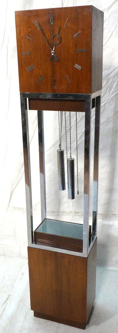 Modernist Standing Floor Clock. Wood Face and Bas: Modernist Standing Floor Clock. Wood Face and Base. Light up Base. Chrome column supports. Connoisseur Collection by RIDGEWAY. -- Dimensions: H: 68.25 inches: W: 14 inches: D: 9.25 inches ---