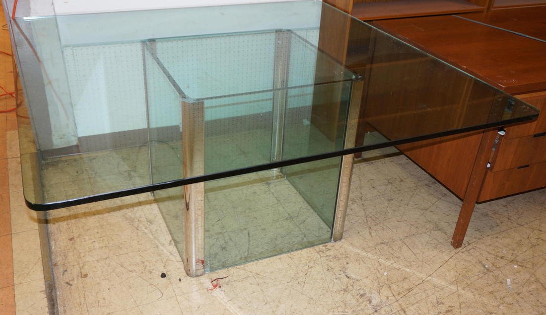 Thick Glass Square Dining Table. Four sided glass: Thick Glass Square Dining Table. Four sided glass panel base with chrome corners. -- Dimensions: H: 29 inches: W: 60 inches: D: 60 inches ---
