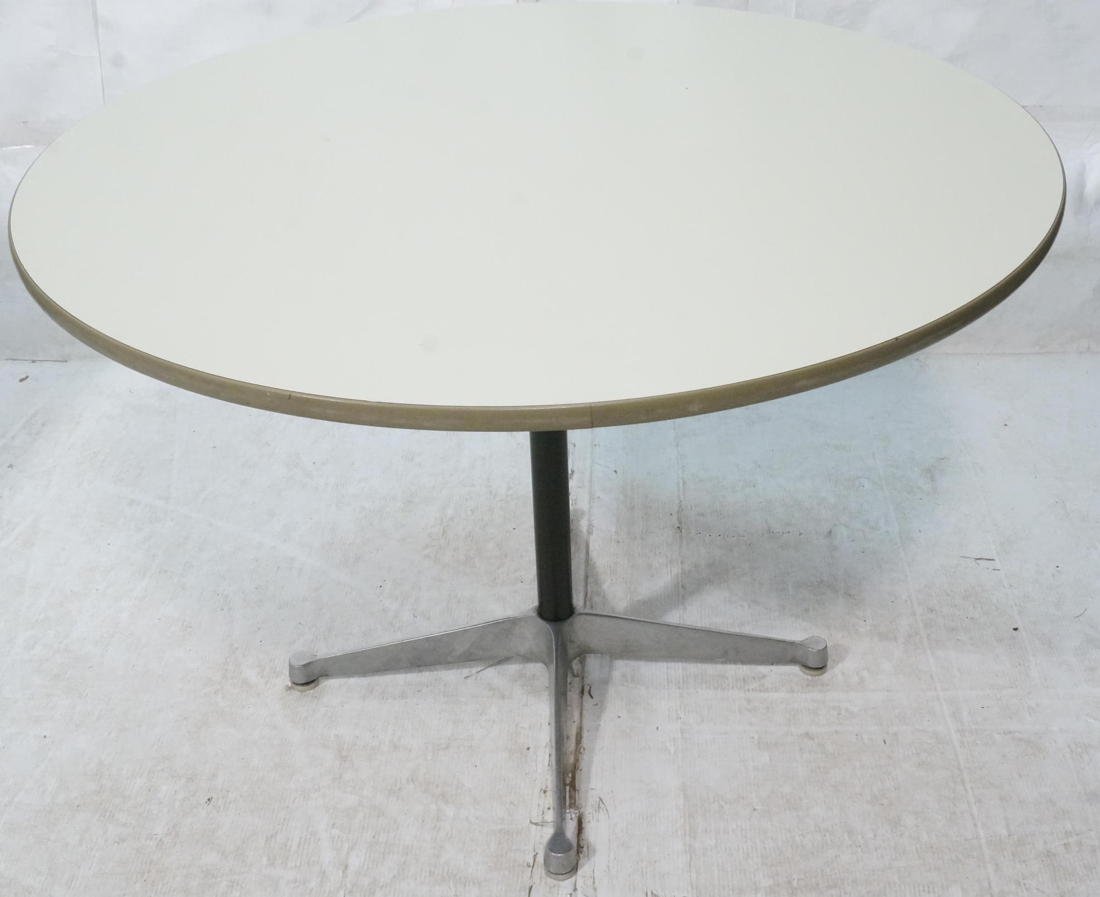HERMAN MILLER Round Laminate Top Dining Table. Bl: HERMAN MILLER Round Laminate Top Dining Table. Black pedestal with four aluminum feet. Gray rubber trim. Herman Miller black tag.-- Dimensions: H: 28.75 inches: W: 40 inches: D: 40 inches ---