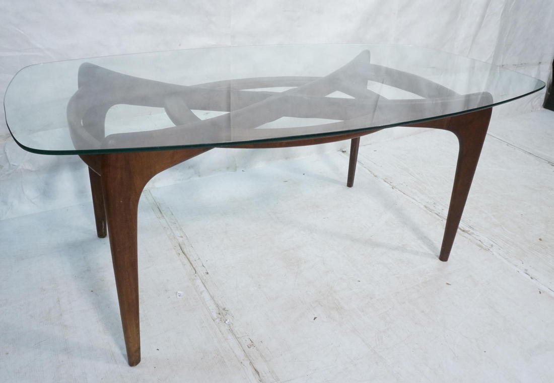 ADRIAN PEARSALL Walnut & Glass Dining Table. Waln: ADRIAN PEARSALL Walnut & Glass Dining Table. Walnut base with decorative oval center detail. Shaped glass top. -- Dimensions: H: 29 inches: W: 72 inches: D: 40 inches ---