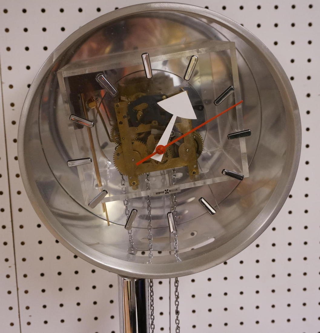 Howard Miller Aluminum Wall Clock with Chrome Wei: Howard Miller Aluminum Wall Clock with Chrome Weights. Clock face diameter 12. Mirrored back.-- Dimensions: ---