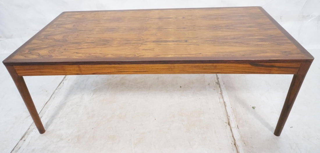 Danish Modern Rosewood Coffee Cocktail Table. Lar: Danish Modern Rosewood Coffee Cocktail Table. Large top on tapered legs. Marked NR806.-- Dimensions: H: 19.75 inches: W: 55 inches: D: 28.25 inches ---