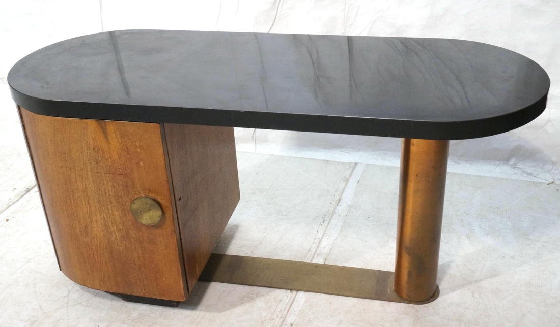 Art Deco GILBERT ROHDE style Desk. Left side one: Art Deco GILBERT ROHDE style Desk. Left side one door Cabinet supports black laminate top. Large copper tube cylinder leg. -- Dimensions: H: 28.25 inches: W: 57 inches: D: 22 inches ---