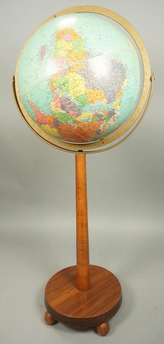World Globe on Walnut Modernist Pedestal Stand. F: World Globe on Walnut Modernist Pedestal Stand. Four ball feet. Brass accents.-- Dimensions: H: 34 inches: W: 15 inches ---