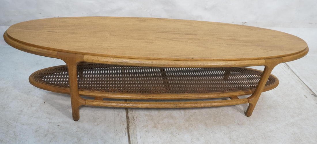 Two Tier Surfboard American Modern Cocktail Coffe: Two Tier Surfboard American Modern Cocktail Coffee Table. Lower caned shelf. Shaped frame & legs. -- Dimensions: H: 15.5 inches: W: 60 inches: D: 18 inches ---