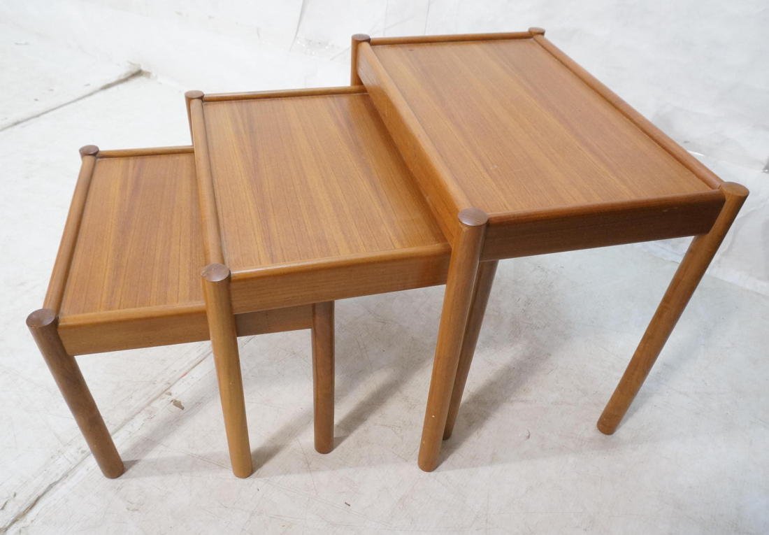 3pc Teak Modern Nesting Tables. Round peg legs. D: 3pc Teak Modern Nesting Tables. Round peg legs. Danish Modern style. -- Dimensions: H: 21 inches: W: 24.5 inches: D: 15 inches ---