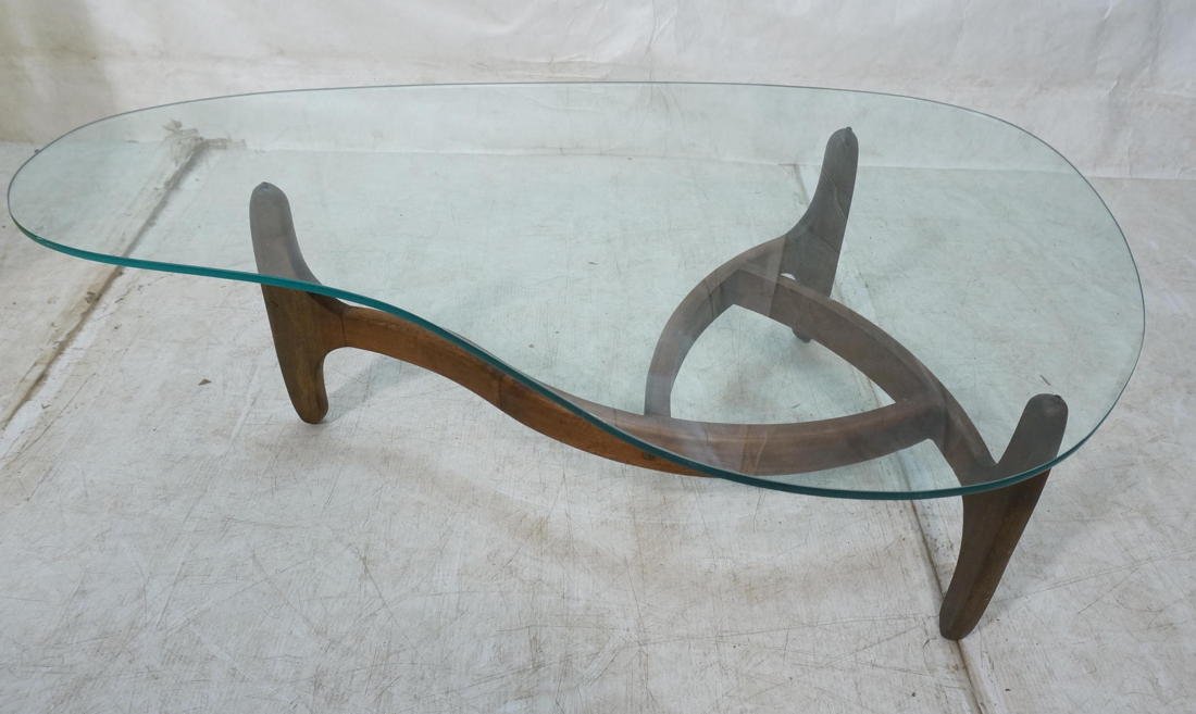 Adrian Pearsall style coffee table. Shaped glass: Adrian Pearsall style coffee table. Shaped glass top. Open center.-- Dimensions: H: 15 inches: W: 15.5 inches: D: 31 inches ---