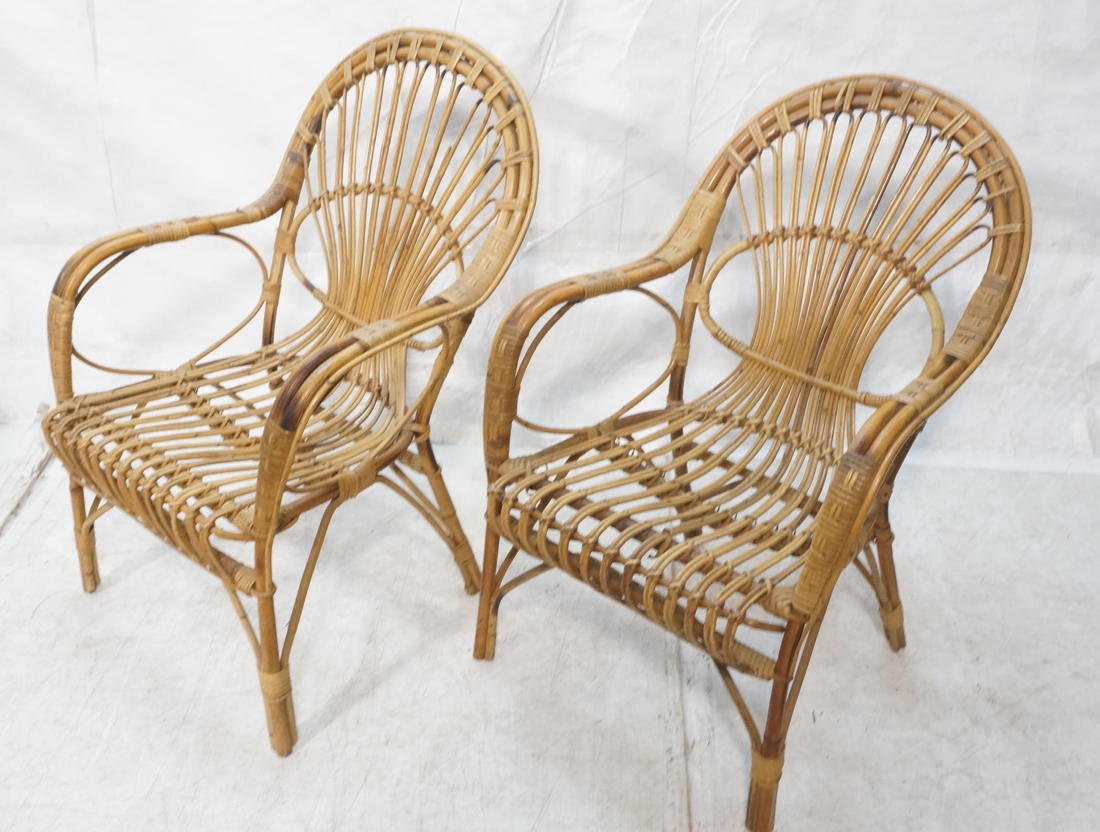 Pair of Franco Albini style lounge chairs. Woven: Pair of Franco Albini style lounge chairs. Woven rattan design.-- Dimensions: H: 35 inches: W: 23.5 inches: D: 23 inches ---