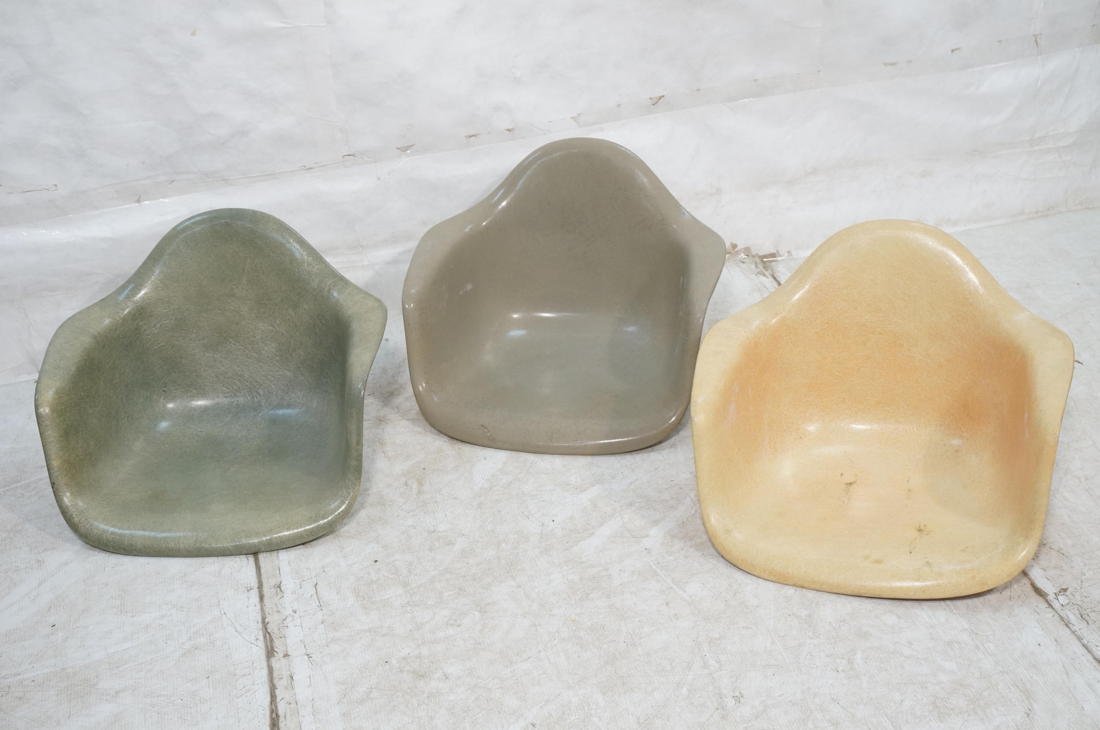 3 Herman Miller Charles Eames fiberglass chair sh: 3 Herman Miller Charles Eames fiberglass chair shells. 2 have early labels.-- Dimensions: H: 17 inches: W: 25 inches: D: 24 inches ---