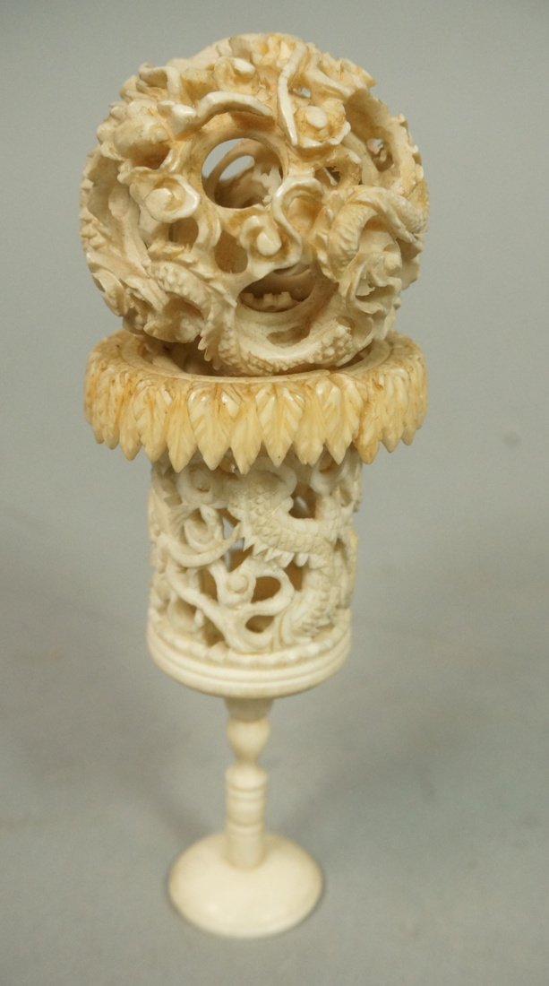 Carved Ivory Puzzle Ball and stand. Ball in a bal: Carved Ivory Puzzle Ball and stand. Ball in a ball in a ball in a ball design. Dragon motif. -- Dimensions: H: 5 inches: W: 2 inches: D: 2 inches --- US Shipping charge: $20