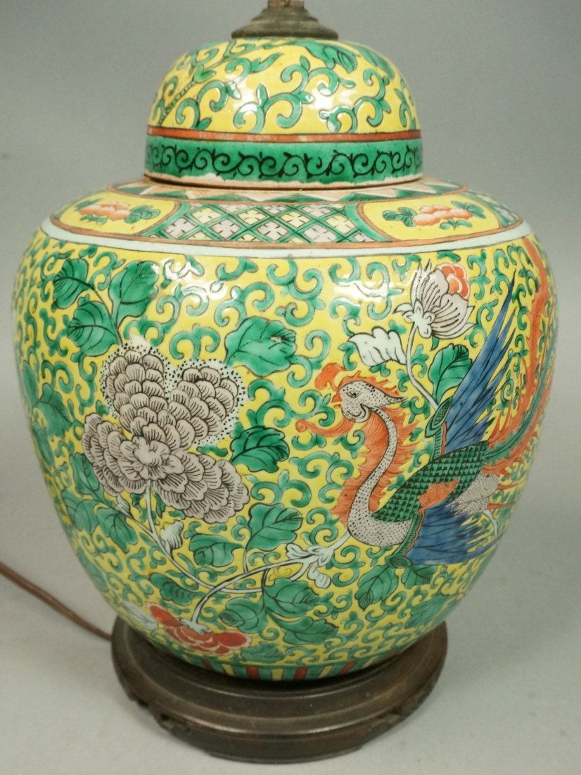 Porcelain Ginger Jar Table Lamp. Asian Ceramic Li: Porcelain Ginger Jar Table Lamp. Asian Ceramic Lidded Jar with Yellow & Green Design with Phoenix Bird and Flowers. Wood Base. Ceramic jar is 10"H-- Dimensions: H: 27 inches: W: 9 inches: D: 9 inches 