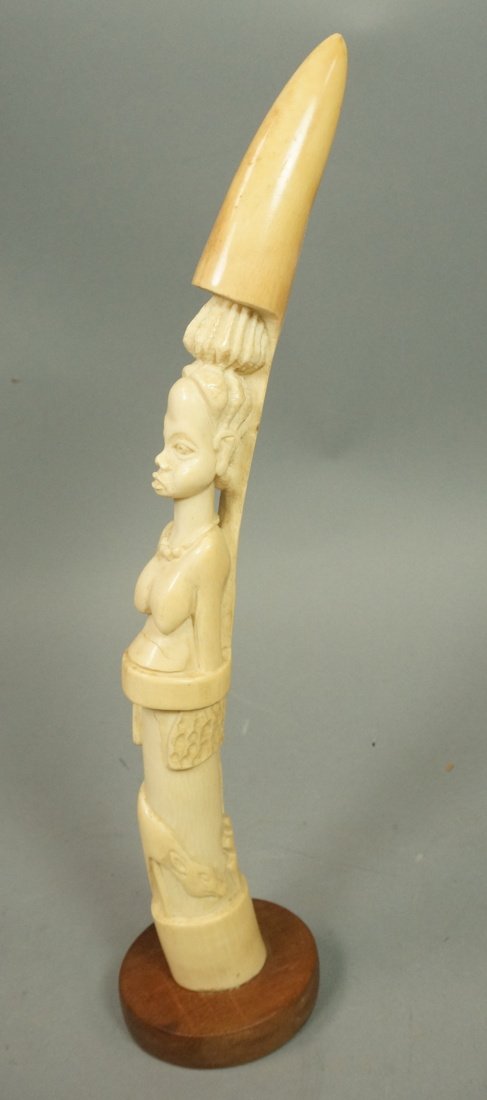Antique African Carving. Carved fertility totem w: Antique African Carving. Carved fertility totem with female and animals. Antique ivory tusk form.-- Dimensions: H: 17 inches --- US Shipping charge: $35