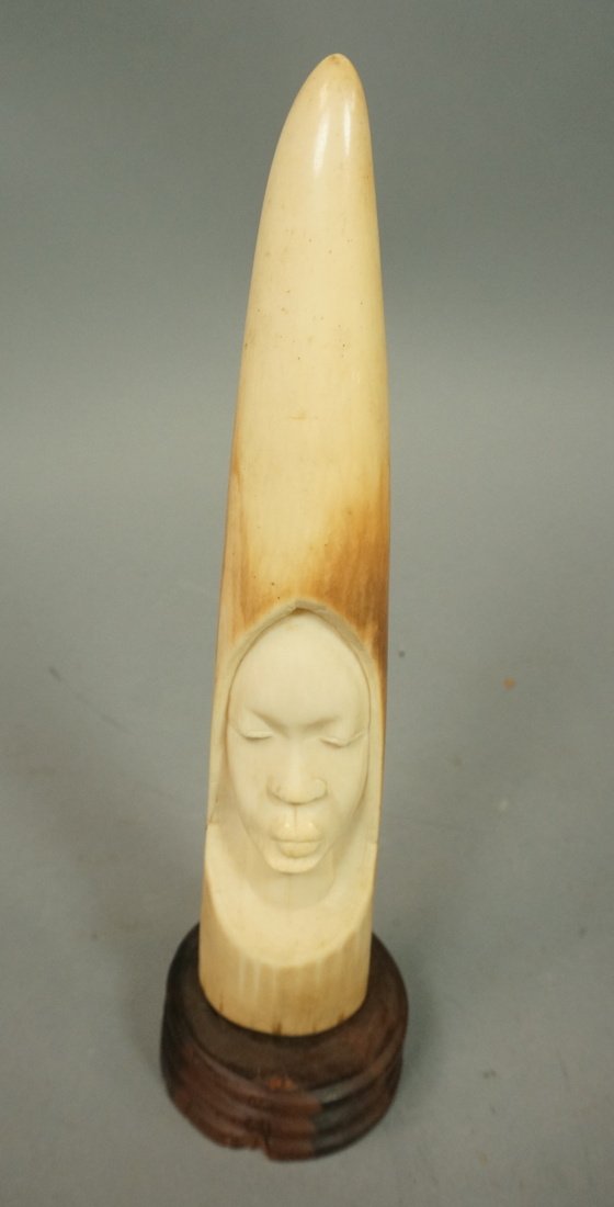 Antique African Carved Sculpture. Female Head. Ca: Antique African Carved Sculpture. Female Head. Carved ivory tusk form. -- Dimensions: H: 10 inches --- US Shipping charge: $35