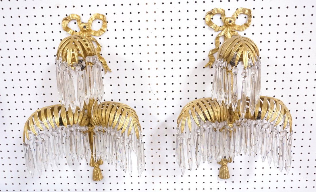 Pair Large Gilt Palm Leaf Wall Sconces with Spire: Pair Large Gilt Palm Leaf Wall Sconces with Spire Prisms. Matches proceeding lot. 3 arm design. Ribbon and swag. Bronze or brass.-- Dimensions: H: 22 inches: W: 14.5 inches: D: 9 inches ---