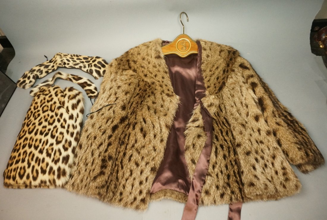 Lot of Furs. Fur short coat. 2 leopard collars.: Lot of Furs. Fur short coat. 2 leopard collars. Leopard hand muff.-- Dimensions: No Size listed. 18 inches shoulder to shoulder. 20.5 inches, shoulder to wrist --- US Shipping charge: $20