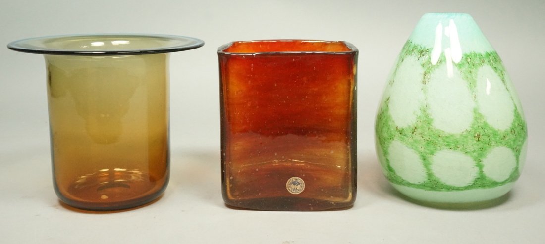 3pcs Art Glass Vase Lot. 1. HOLMEGAARD Denmark Sq: 3pcs Art Glass Vase Lot. 1. HOLMEGAARD Denmark Square Amber Glass Vase. Marked Holmegaard, R. 616622, Paper label. 2. Flared Rim Topaz Brown Glass Vase with flared rim & blue lip. Not marked. 3. Green