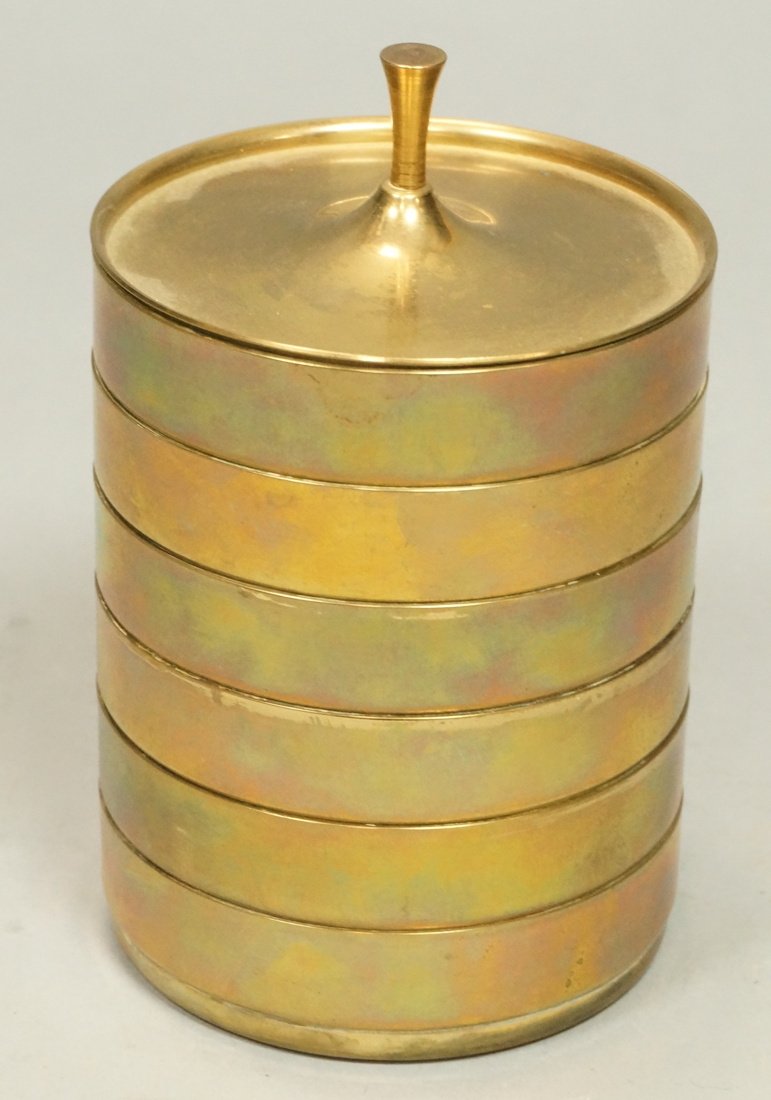 Brass Stacking Coaster Set. TOMMI PARZINGER. Six: Brass Stacking Coaster Set. TOMMI PARZINGER. Six nesting coasters capped by brass lid with knob finial. Marked. -- Dimensions: H: 5.5 inches: W: 3.75 inches: D: 3.75 inches --- US Shipping charge: $20