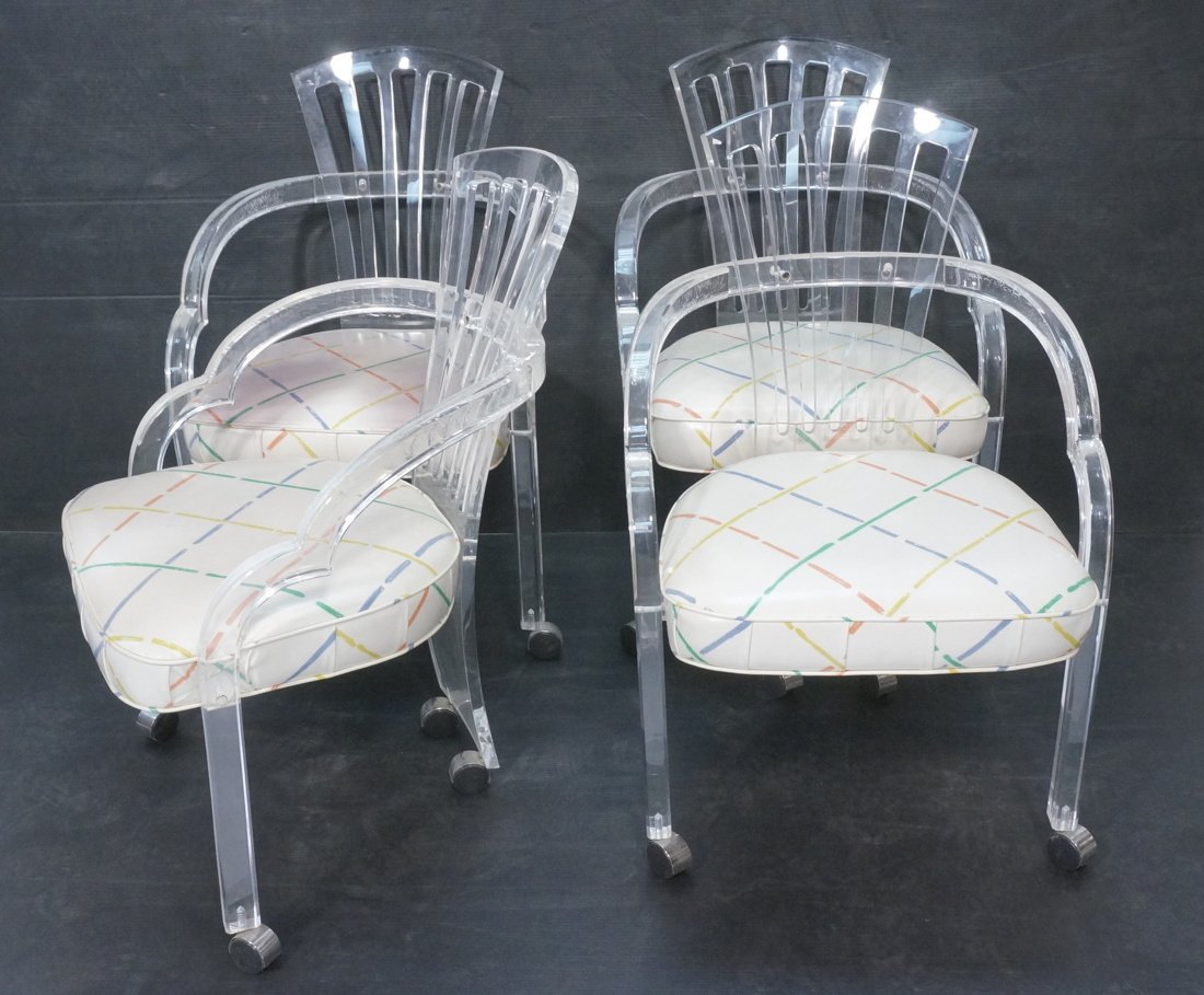 Set 4 Lucite Lounge Arm Chairs. Pierced fan shape: Set 4 Lucite Lounge Arm Chairs. Pierced fan shaped back with shaped arms. Vinyl upholstery. Not marked. -- Dimensions: H: 34 inches: W: 21 inches: D: 23 inches ---