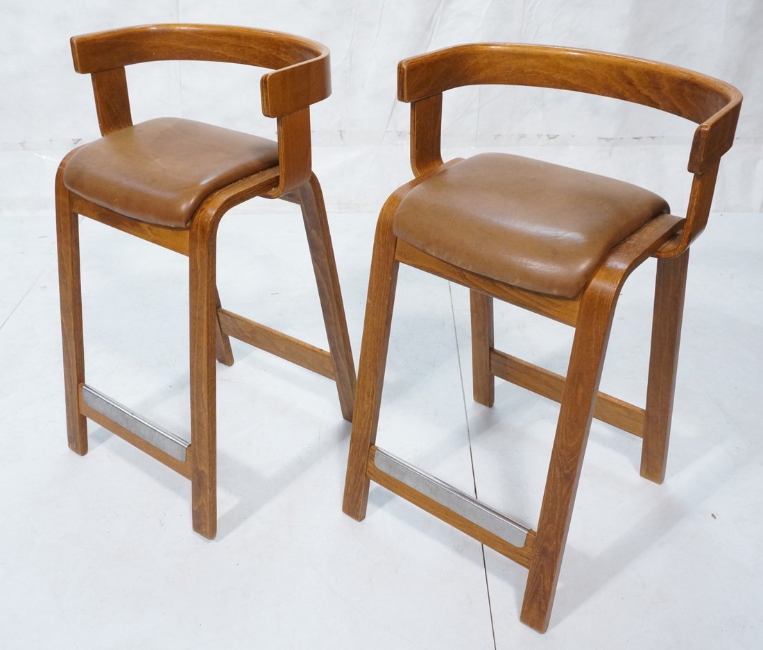 Pr Thonet style Bar Stools. Molded Wood Frames wi: Pr Thonet style Bar Stools. Molded Wood Frames with Tan Leather Seats. Barrel backs. Metal trim to footrest-- Dimensions: H: 32.5 inches: W: 20.25 inches: D: 20 inches ---