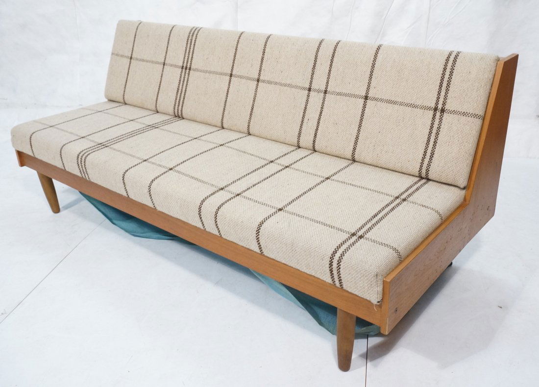 Hans Wegner style Daybed Sofa. Danish teak. Cream: Hans Wegner style Daybed Sofa. Danish teak. Cream plaid fabric upholstery. Flips out to double sleeping capacity. -- Dimensions: H: 32 inches: W: 77 inches: D: 32.5 inches ---