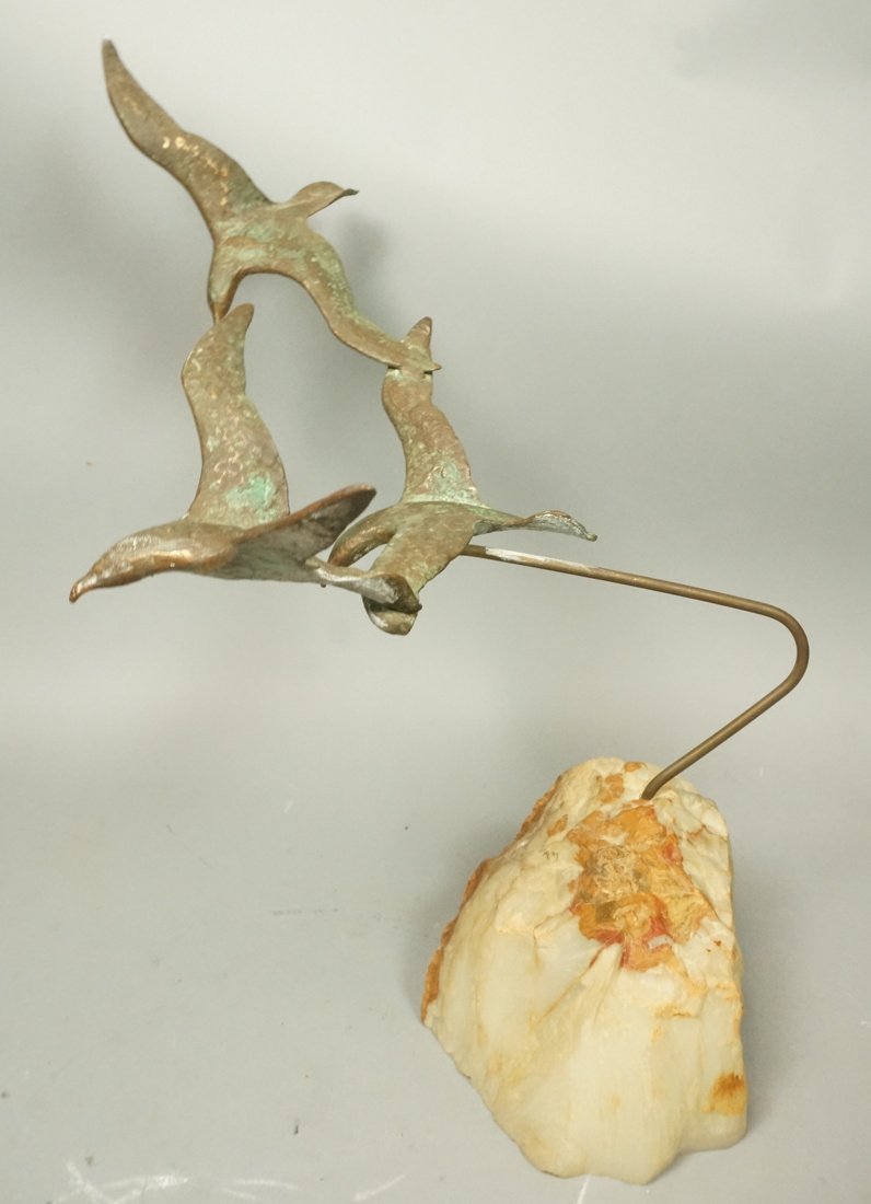 TEGAY Brass Birds in Flight Sculpture. Mounted on: TEGAY Brass Birds in Flight Sculpture. Mounted on rock. Signed. -- Dimensions: H: 21 inches: W: 17 inches: D: 17 inches ---