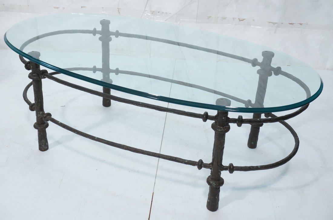 GIACOMETTI style Heavy Bronze Oval Glass Coffee T: GIACOMETTI style Heavy Bronze Oval Glass Coffee Table. Thick glass top cocktail table-- Dimensions: H: 16.5 inches: W: 47.5 inches: D: 26 inches ---
