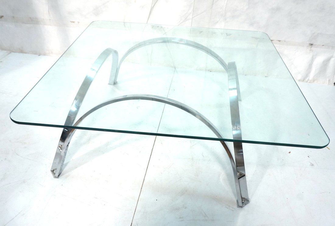 Glass & Chrome Square Modernist Coffee Table.: Glass & Chrome Square Modernist Coffee Table. Four chrome arched legs. Glass top with rounded corners. Baughman style. -- Dimensions: H: 14.75 inches: W: 38 inches: D: 38 inches ---