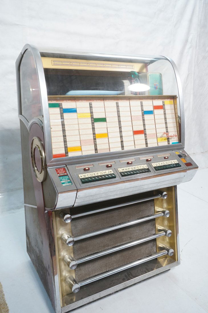 Vintage 1956 Seeburg Select-o-matic High fidelity: Vintage 1956 Seeburg Select-o-matic High fidelity jukebox. Model V-200. Plays size 45 records. Chrome and brass accents. Glass case. With keys.-- Dimensions: H: 58 inches: W: 36 inches: D: 27 inches -