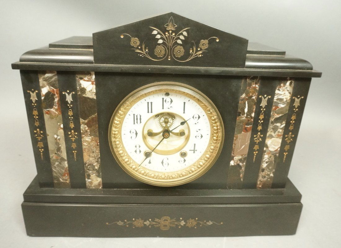 Marble cased Seth Thomas Thomaston CT USA Mantle: Marble cased Seth Thomas Thomaston CT USA Mantle clock. Key wind. Chimes. Last recorded repair date 6/16/1911. 4 columns of different marble inlayed in front. Etched floral design.-- Dimensions: H: 12