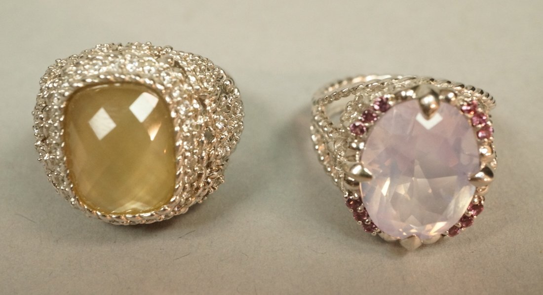 2pcs Sterling Silver Judith Ripka Ladies Rings. 1: 2pcs Sterling Silver Judith Ripka Ladies Rings. 1). Large size 9 cocktail ring with faceted pale yellow stone. 2) Fleur de Lis embellished cocktail ring with pale pink stone. Both marked-- Dimensions: