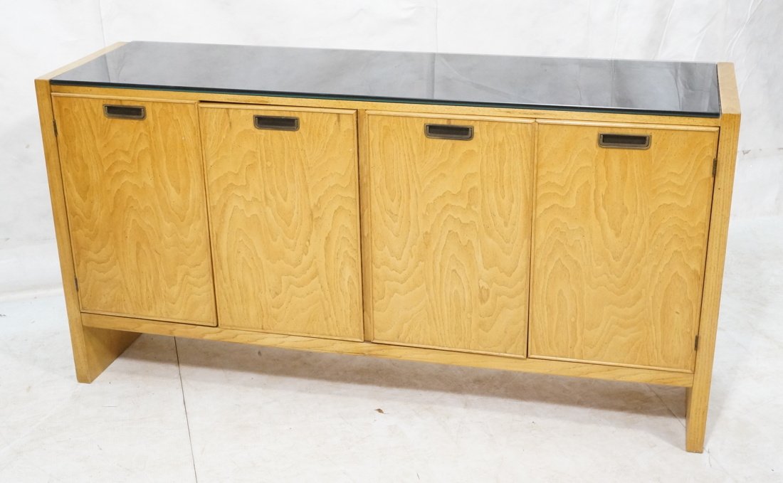 American Modern Credenza with smoked glass insert: American Modern Credenza with smoked glass insert top. 4 Doors. 1 is a cabinet, and 1 has 3 interior drawers. Recessed metal pulls.-- Dimensions: H: 34 inches: W: 66 inches: D: 18 inches ---
