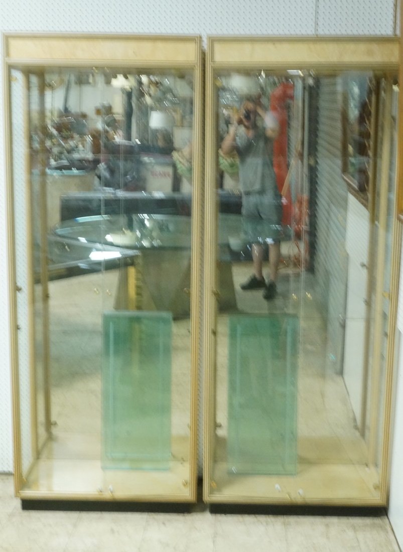 Pair of HENREDON display cabinets. Multi wood ban: Pair of HENREDON display cabinets. Multi wood band around edges. Mirrored backs. 4 glass shelves each. -- Dimensions: H: 82 inches: W: 32 inches: D: 15.5 inches ---