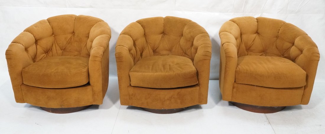 3pc SELIG Barrel Back Lounge Chairs. Milo Baughma: 3pc SELIG Barrel Back Lounge Chairs. Milo Baughman style. Swivel & rock. Wood veneer bases. Tufted light brown fabric. Marked Selig label-- Dimensions: H: 26 inches: W: 31.5 inches: D: 32 inches ---