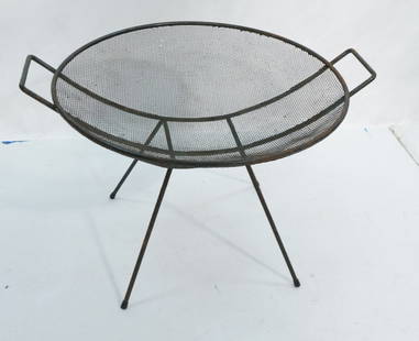 SOL BLOOM "Catch it all" Mesh Round Table. Metal: SOL BLOOM "Catch it all" Mesh Round Table. Metal Mesh Screen in iron rod frame with two handles and hairpin legs. -- Dimensions: H: 17.5 inches: W: 26 inches: D: 22 inches ---