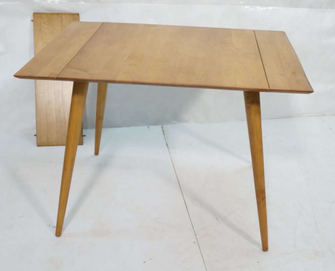 PAUL McCOBB Maple Drop Side Dining Table. Planner: PAUL McCOBB Maple Drop Side Dining Table. Planner Group. Two 10" leaves. Label. -- Dimensions: H: 29.25 inches: W: 30 inches: D: 30 inches ---