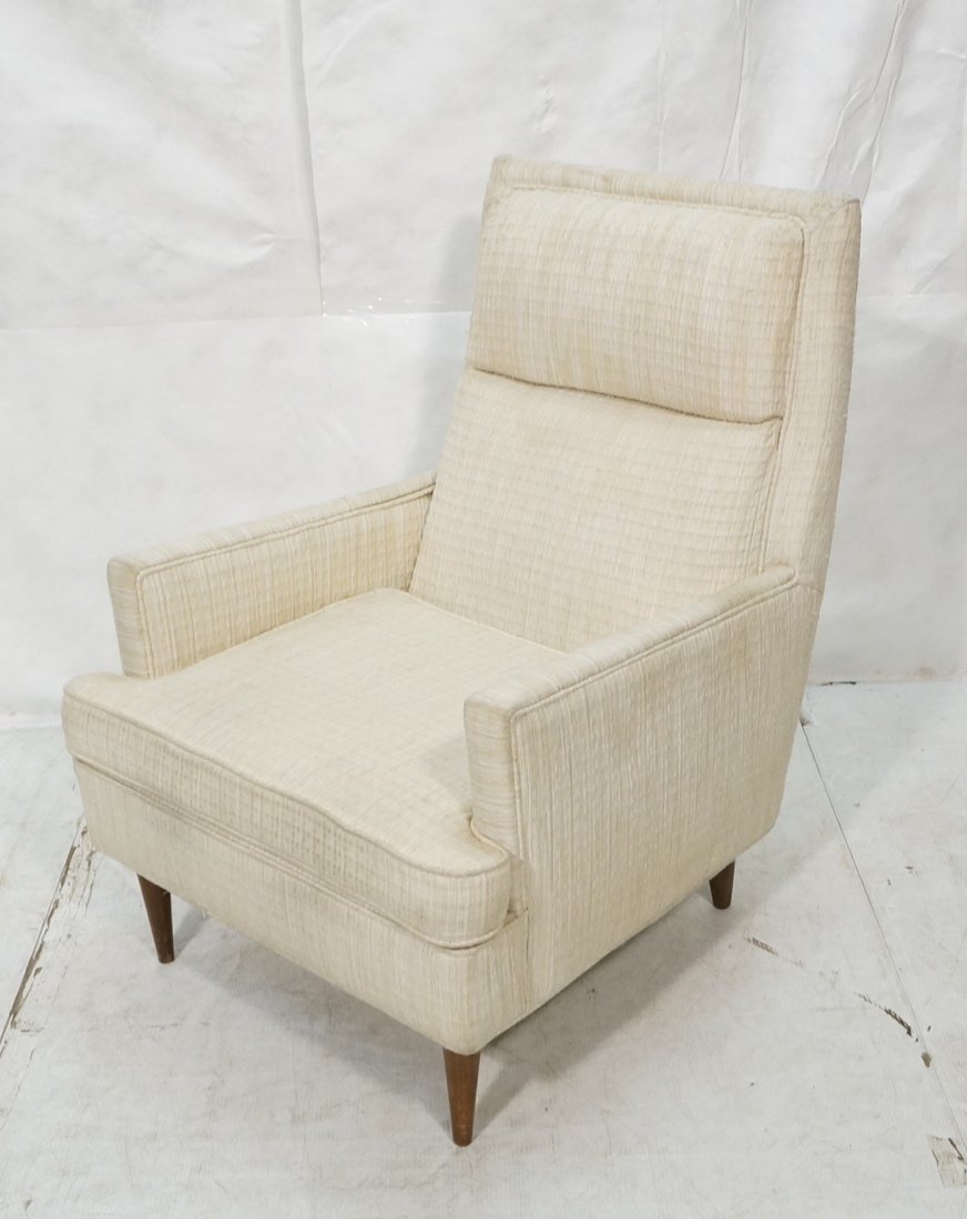 Paul McCobb style Tall Back Lounge Chair. Arm Cha: Paul McCobb style Tall Back Lounge Chair. Arm Chair. Peg legs. White upholstery.-- Dimensions: H: 40 inches: W: 31 inches: D: 36 inches ---