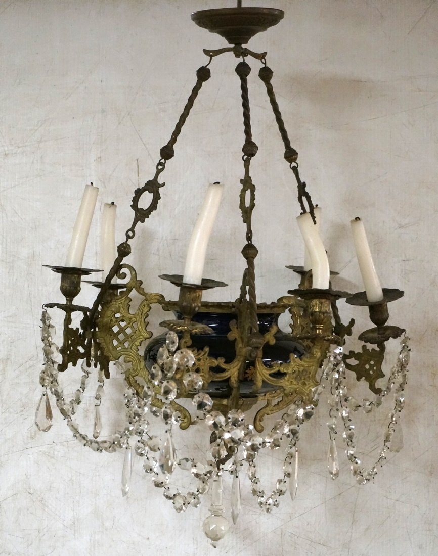 Vintage Chandelier with Cobalt Blue Porcelain. Th: Vintage Chandelier with Cobalt Blue Porcelain. Three brass arms hold six candles. Not electrified. Blue porcelain element with enamel paint decoration. Crystal garlands with teardrop prisms.-- Dimensi