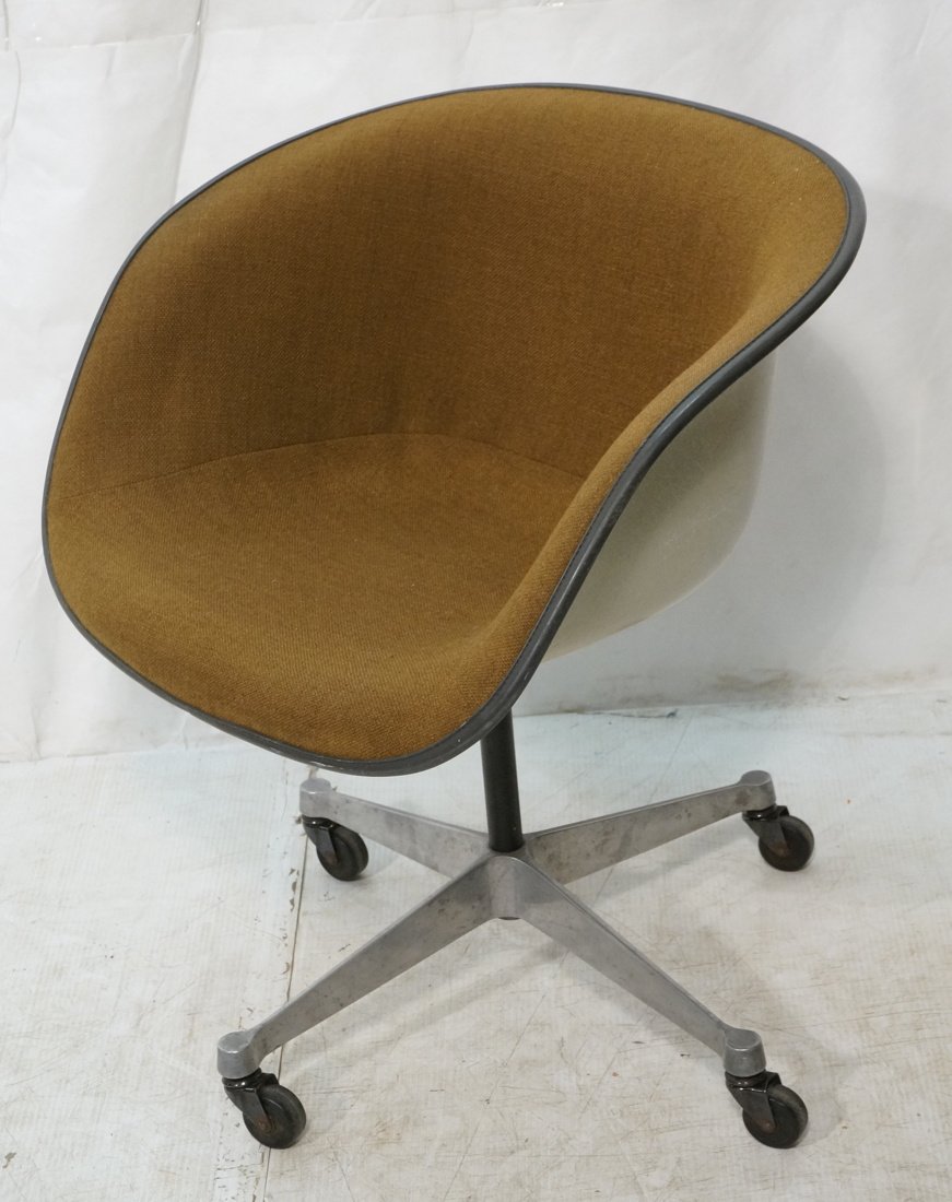 Herman Miller Upholstered office desk chair. Mold: Herman Miller Upholstered office desk chair. Molded fiberglass shell seat with brown fabric. Four legged pedestal base. Marked.-- Dimensions: H: 28 inches: W: 25 inches: D: 23 inches ---