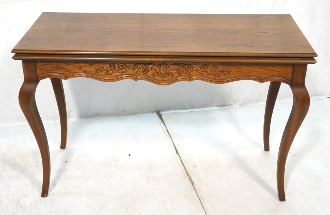 Hall Console Table converts to Dining Table. Flip: Hall Console Table converts to Dining Table. Flip top with (5) 12" leaves. Carved and scalloped skirt. Marked EXTENSOLE. -- Dimensions: H: 30.5 inches: W: 48 inches: D: 20 inches ---