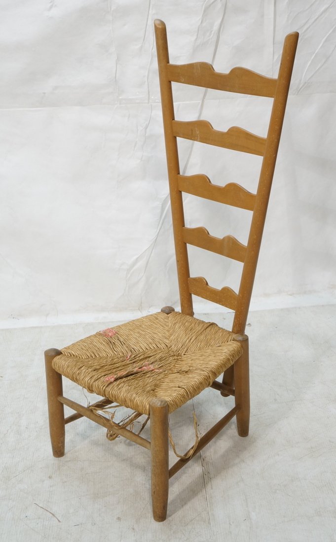 Gio Ponti attributed Ladder Back Chair. Low woven: Gio Ponti attributed Ladder Back Chair. Low woven seat with tall flared back. Not marked-- Dimensions: H: 41 inches: W: 17 inches: D: 17 inches ---